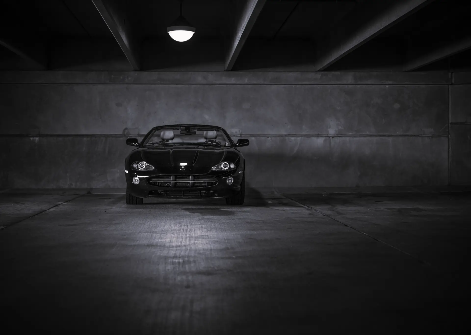 Performance sports car in a dark studio